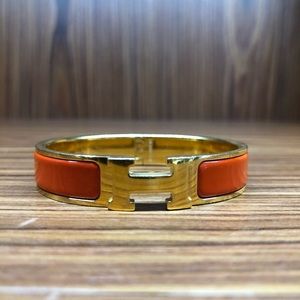 Hermès narrow Clic Clac H bracelet in orange ename